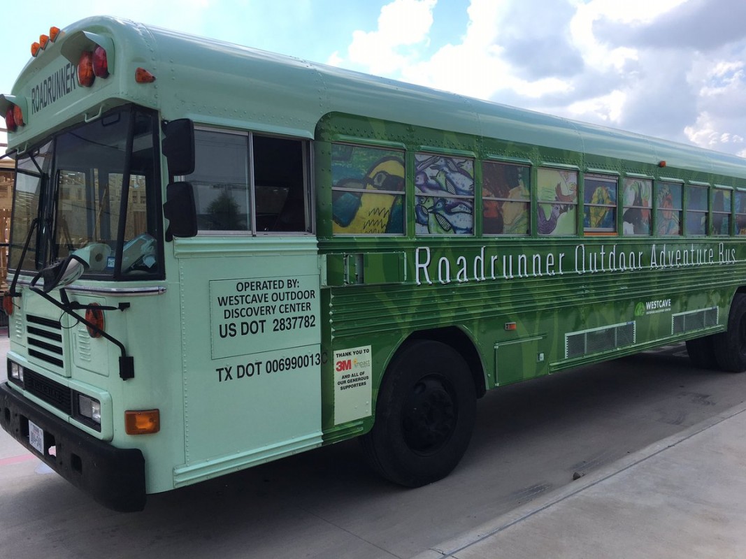 bus with student artwork displayed on the windows.